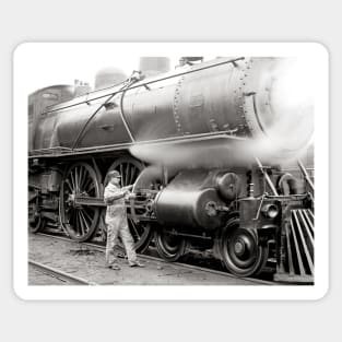 Engineer Oiling Locomotive, 1904. Vintage Photo Sticker